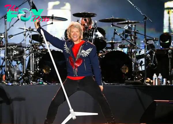 Jon Bon Jovi performing on stage. 
