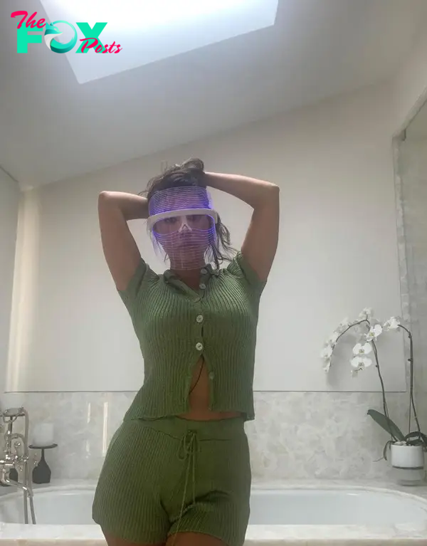 Kourtney Kardashian in an LED mask