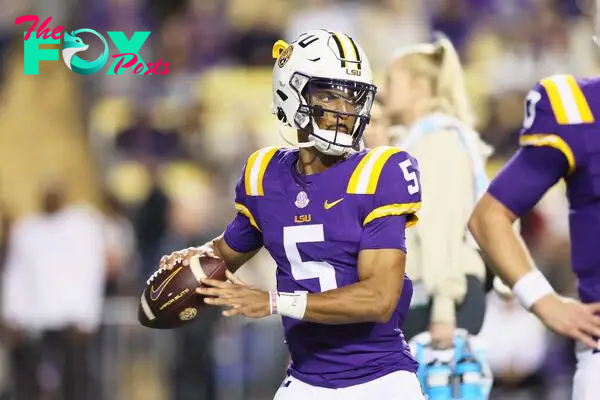 Nov 18, 2023; Baton Rouge, Louisiana, USA; Heisman Trophy candidate LSU Tigers quarterback Jayden Daniels (5) warms up before their game against the Georgia State Panthers at Tiger Stadium. Mandatory Credit: Matthew Dobbins-USA TODAY Sports