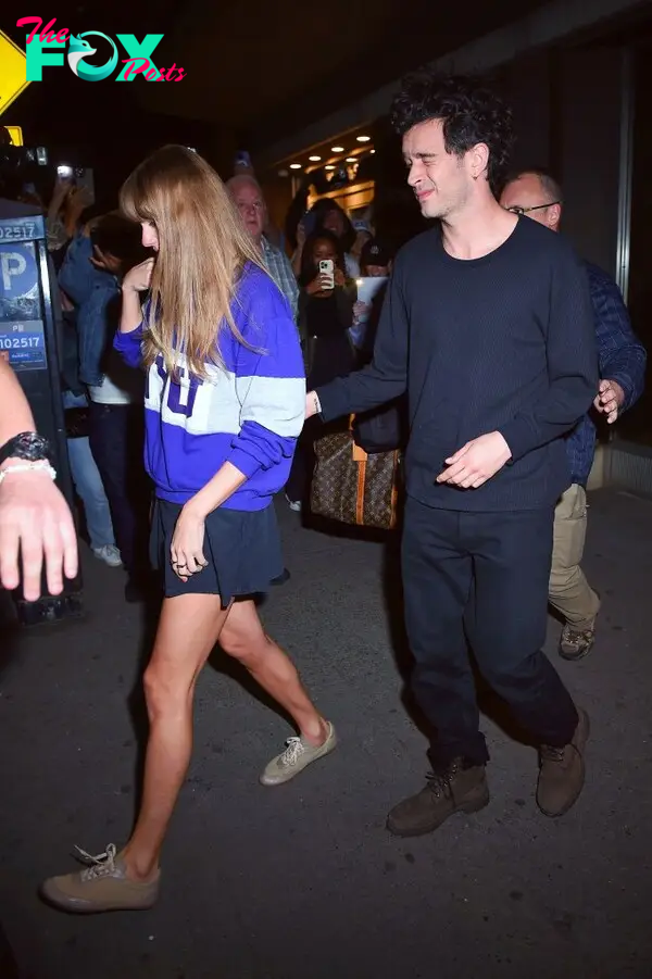 Taylor Swift and Matty Healy walking