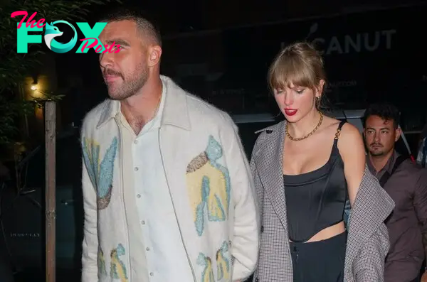 Taylor Swift and Travis Kelce hold hands