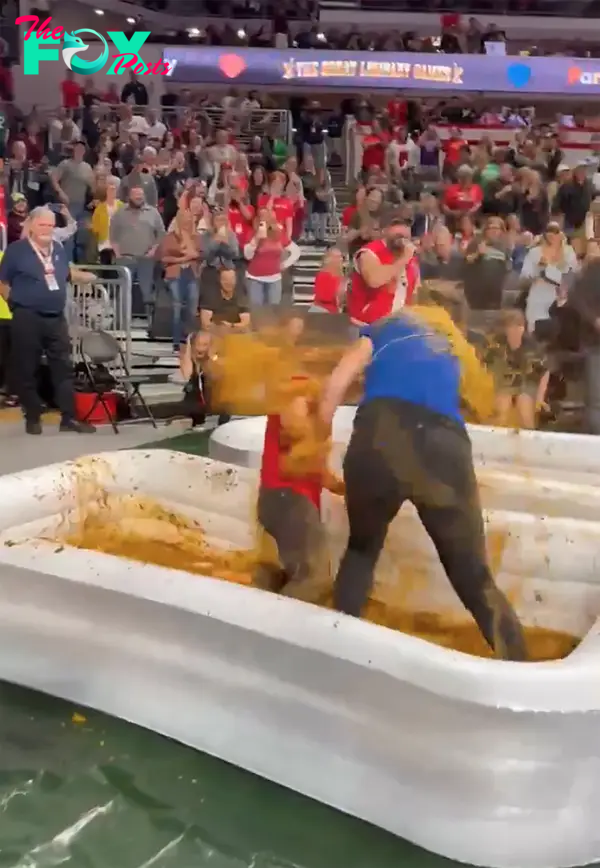 Contestants in a vat of chili.