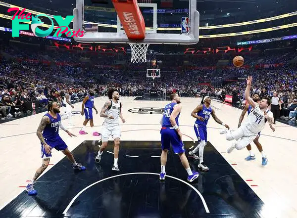 Luka Doncic #77 of the Dallas Mavericks takes a shot against the LA Clippers 