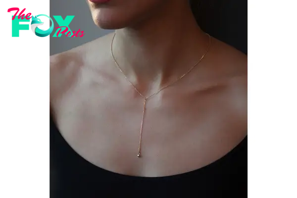 A model in a delicate chain necklace