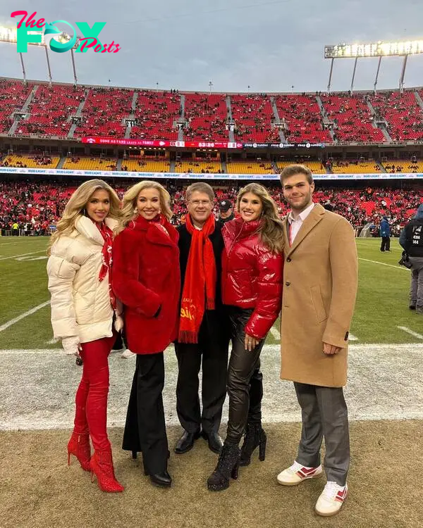 The Hunt family on a football field.