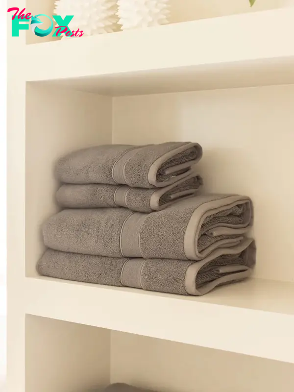Gray bath towels on a shelf