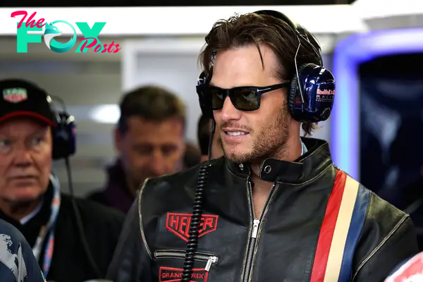 NFL star Tom Brady in the Red Bull Racing garage.
