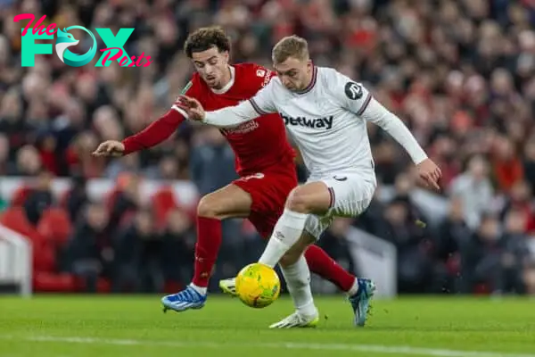 LIVERPOOL, ENGLAND - Wednesday, December 20, 2023: West Ham United's Jarrod Bowen (R) is challenged by Liverpool's Curtis Jones during the Football League Cup Quarter-Final match between Liverpool FC and West Ham United FC at Anfield. (Photo by David Rawcliffe/Propaganda)