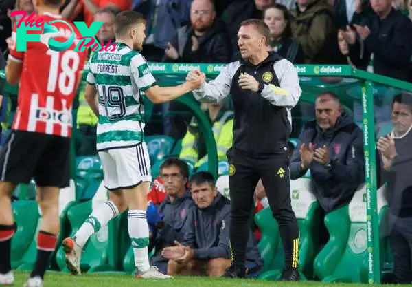James Forrest of Celtic comes off and shakes the hand of the Celtic manager Brendan Rodgers  during the pre-season friendly match between Celtic an...