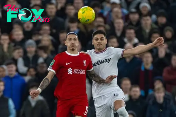 LIVERPOOL, ENGLAND - Wednesday, December 20, 2023: Liverpool's Darwin Núñez (L) and West Ham United's Konstantinos Mavropanos during the Football League Cup Quarter-Final match between Liverpool FC and West Ham United FC at Anfield. (Photo by David Rawcliffe/Propaganda)