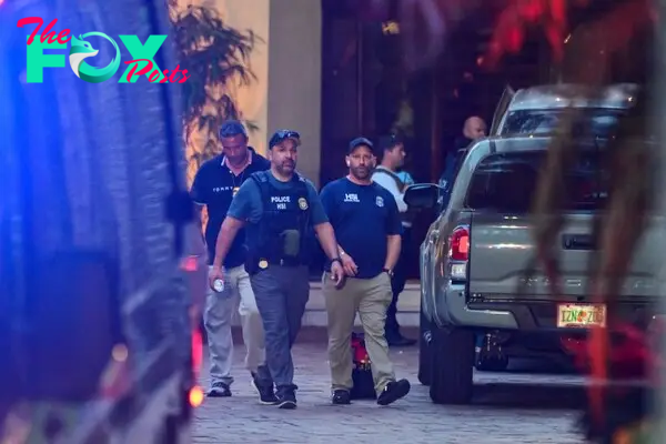 Homeland Security agents amid the raid on Diddy's homes.