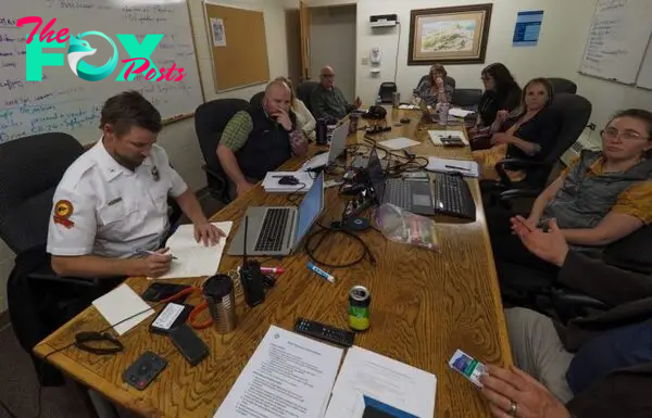 a group of health care professionals gathered around a conference table