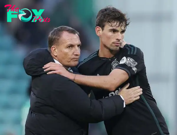 Celtic manager Brendan Rodgers and Matt O'Riley are seen during the Cinch Scottish Premiership match between Hibernian FC and Celtic FC at Easter R...