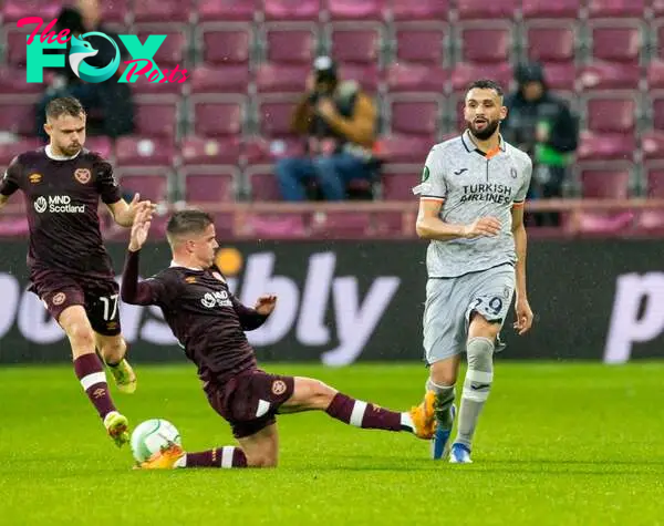 Cammy Devlin of Heart of Midlothian and Ahmed Touba of Istanbul Basaksehir battle for the ball during the UEFA Europa Conference League group A mat...