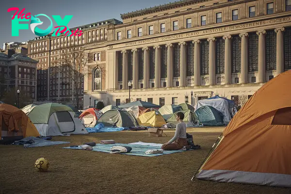 A protestor meditates early Monday morning inside the pro-Palestinian encampment on Columbia University campus in New York City, on April 29, 2024.