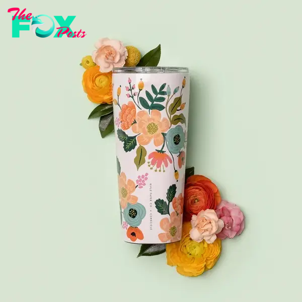 A tumbler with flowers on it 