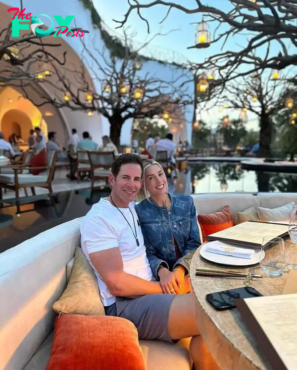 Heather Rae Young and Tarek El Moussa at a dinner. 