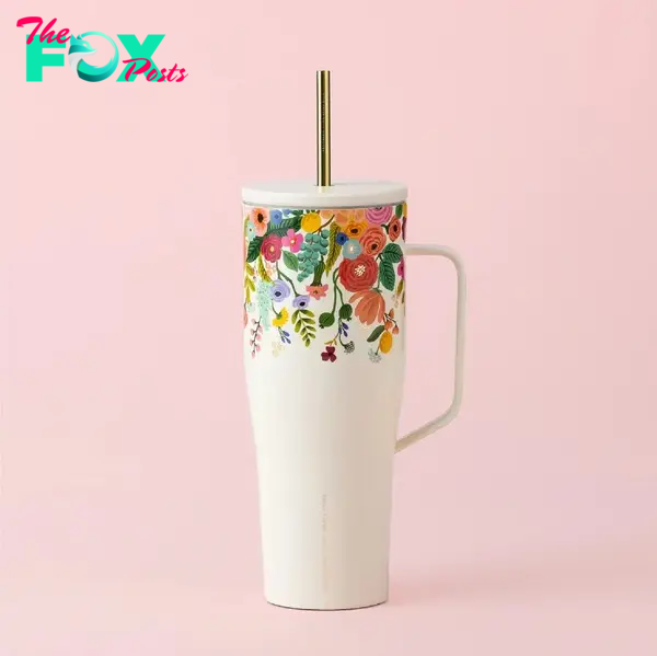 A floral cup with a straw