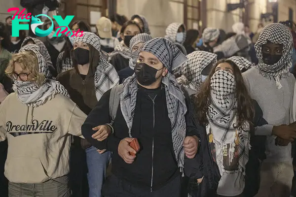 Protestors block Hamilton Hall as they take over the interior of the building on Columbia University campus during a pro-Palestinian encampment, on April 29, 2024.