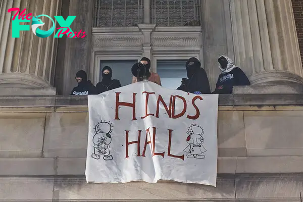Protestors hang a banner saying "HIND'S HALL" from Hamilton Hall on Columbia University campus during a pro-Palestinian encampment. Hind is the name of a 6-year-old Palestinian girl who was killed in Gaza on Jan. 29.
