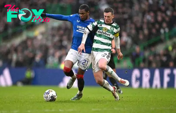 Callum McGregor of Celtic challenges Dujon Sterling of Rangers during the Cinch Scottish Premiership match between Celtic FC and Rangers FC at Celt...