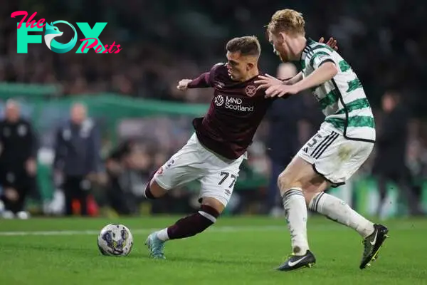 Kenneth Vargas of Hearts vies with Liam Scales of Celtic during the Cinch Scottish Premiership match between Celtic FC and Heart of Midlothian at C...