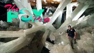 The interior of the Cave of Crystals with a geologist in the foreground.