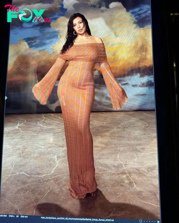 Kourtney Kardashian in a striped dress.