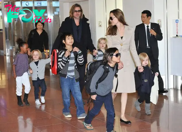 Brad Pitt and Angelina Jolie with their kids in Tokyo, Japan. 