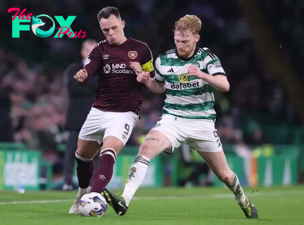 Lawrence Shankland of Hearts vies with Liam Scales of Celtic during the Cinch Scottish Premiership match between Celtic FC and Heart of Midlothian ...