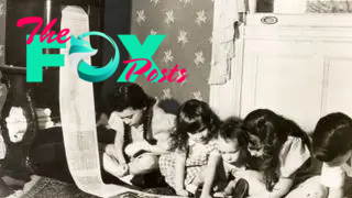 Children kneel on the floor to read a radio newspaper that is being printed.