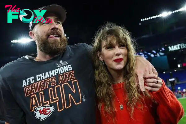 Travis Kelce celebrates with Taylor Swift after defeating the Baltimore Ravens in the AFC Championship Game