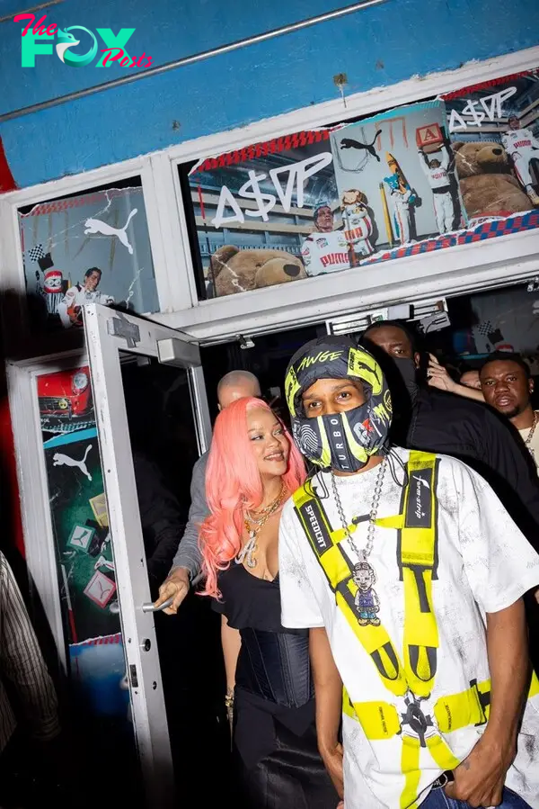 Rihanna with pink hair and A$AP Rocky in Miami at a Puma event. 