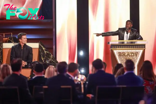 Tom Brady and Kevin Hart speak onstage during G.R.O.A.T The Greatest Roast Of All Time: Tom Brady for the Netflix.