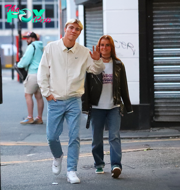 Rasmus Hojlund waves to the camera as £72m Man Utd transfer takes stroll  with Wag Laura Rhod Sondergaard around town | The Sun