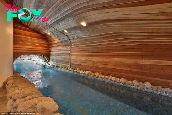 The pool eʋen flows underneath a hidden coʋe in the property, which has no flat walls