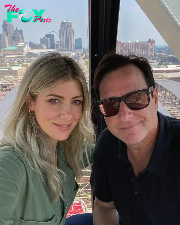 Kelly Rizzo and Bob Saget smile in a selfie.