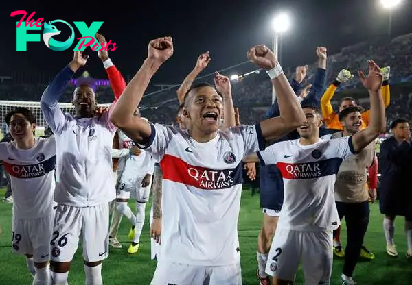 Soccer Football - Champions League - Quarter Final - Second Leg - FC Barcelona v Paris St Germain - Estadi Olimpic Lluis Companys, Barcelona, Spain - April 16, 2024 Paris St Germain's Kylian Mbappe with teammates celebrate after the match REUTERS/Juan Medina