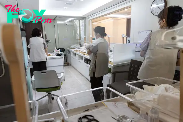 Staff take care of newborns at St. Park, a postpartum care center, or joriwon, in Seoul, South Korea, Jan. 15, 2024.