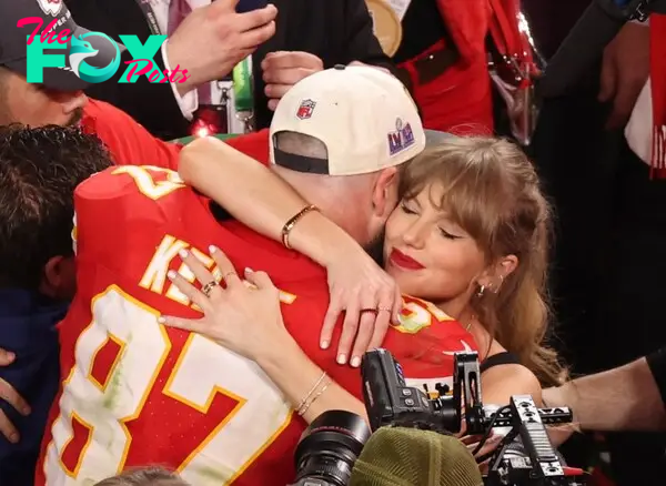 Taylor Swift with Travis Kelce hugging.
