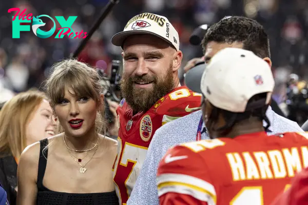 Taylor Swift kissing Travis Kelce after his game.