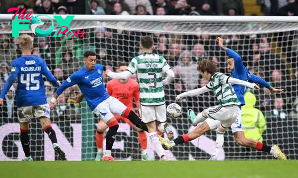 Kyogo Furuhashi of Celtic shoots to score their team's second goal during the Cinch Scottish Premiership match between Celtic FC and Rangers FC at ...