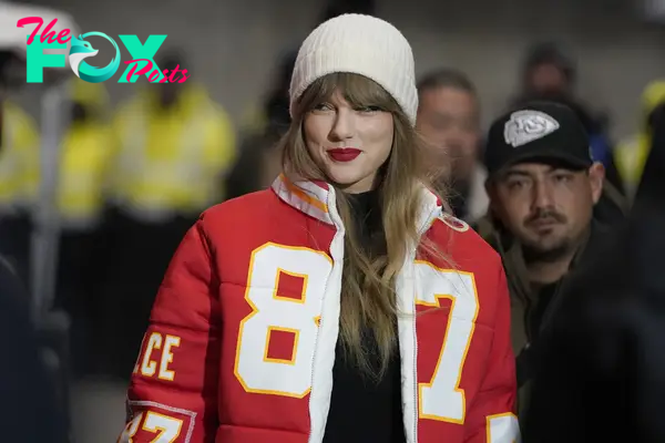 Taylor Swift wearing an No. 87 jacket.