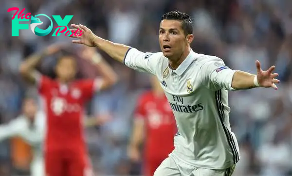 (FILES) Real Madrid's Portuguese striker Cristiano Ronaldo celebrates after his second goal during the UEFA Champions League quarter-final second leg football match Real Madrid vs FC Bayern Munich at the Santiago Bernabeu stadium in Madrid in Madrid on April 18, 2017. Bayern Munich will receive Real Madrid for their UEFA Champions League semi final first leg on April 30, 2024 at the Allianz Arena in Munich, southern Germany. (Photo by Christof STACHE / AFP)