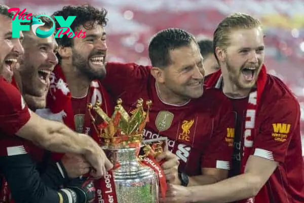 LIVERPOOL, ENGLAND - Wednesday, July 22, 2020: Liverpool’s goalkeeper Andy Lonergan, goalkeeper Adrián San Miguel del Castillo, goalkeeper Alisson Becker, goalkeeping coach John Achterberg and goalkeeper Caoimhin Kelleher celebrate with the Premier League trophy as the Reds are crowned Champions after the FA Premier League match between Liverpool FC and Chelsea FC at Anfield. The game was played behind closed doors due to the UK government’s social distancing laws during the Coronavirus COVID-19 Pandemic. Liverpool won 5-3. (Pic by David Rawcliffe/Propaganda)