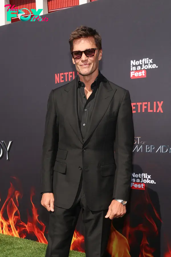 Tom Brady in a black suit.