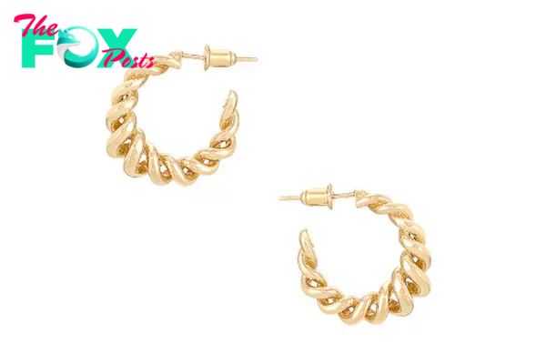 A pair of small gold hoop earrings