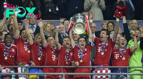 (FILES) This file photo taken on May 25, 2013 shows Bayern Munich's German defender Philipp Lahm lifting the trophy after the UEFA Champions League final football match between Borussia Dortmund and Bayern Munich at Wembley Stadium in London.
Germany weekly sports magazine Sports Bild reported on on February 7, 2017 Bayern Munich's defender Philipp Lahm will retire at the end of the season and also that he would not be taking the position of Sports Director at the club. / AFP PHOTO / CHRISTOF STACHE