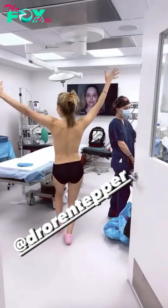 topless jenny mollen entering O.R.