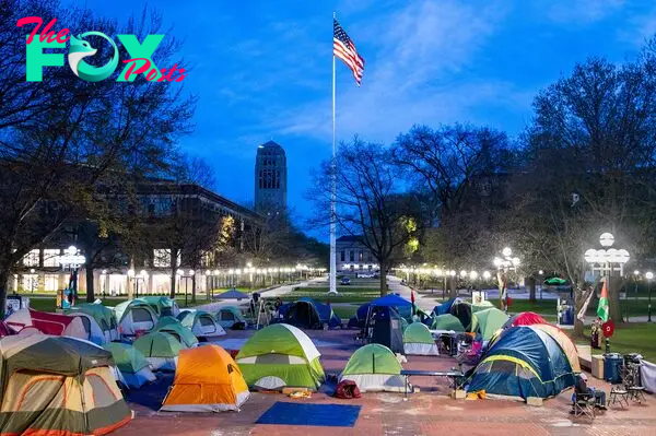 A deep blue sky over several tents set up over the University of Michigan's Central Campus early in the morning on April 23.